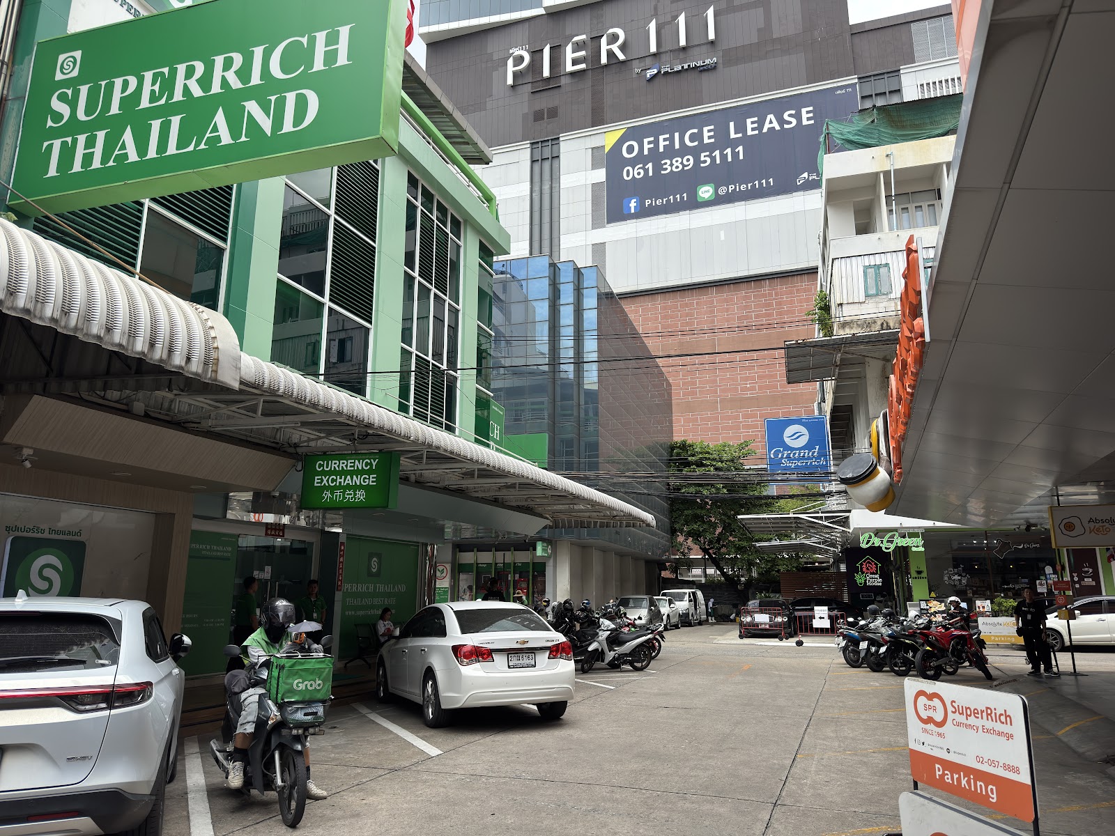 The green SuperRich Thailand head office on Soi Ratchadamri 1 with its currency exchange sign