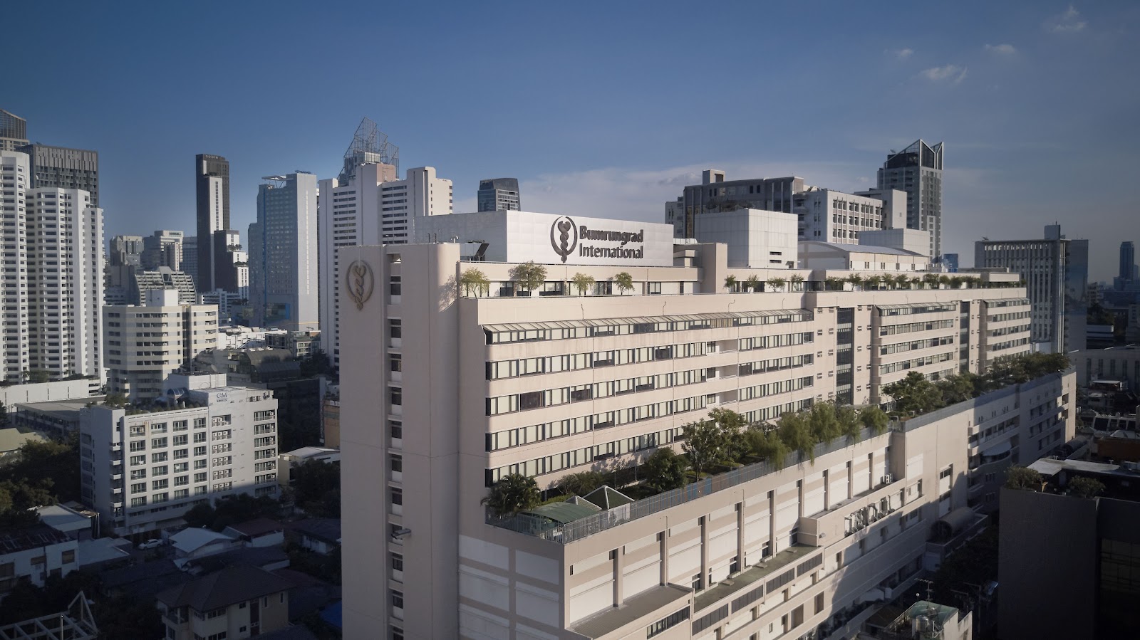 The white buildings of Bumrungrad International Hospital among Sukhumvit high-rises