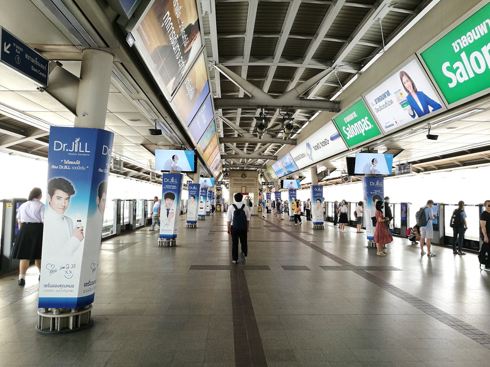 Platform of BTS Siam station in central Bangkok with station signs and platform screen doors