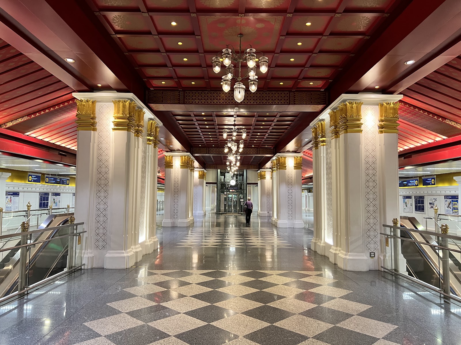 Gilded columns and patterned floor in the concourse of MRT Sanam Chai station