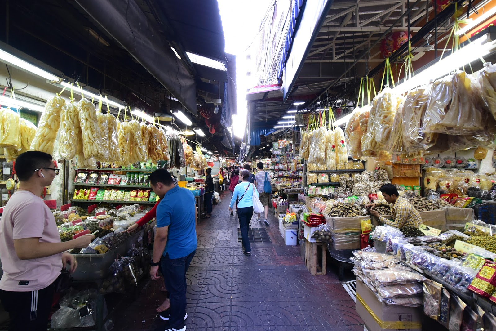 A covered lane of dried-goods stalls at Yaowarat Old Market in Chinatown