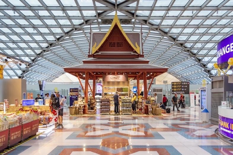 A Thai-style pavilion shop under the glass roof of the Suvarnabhumi departures concourse