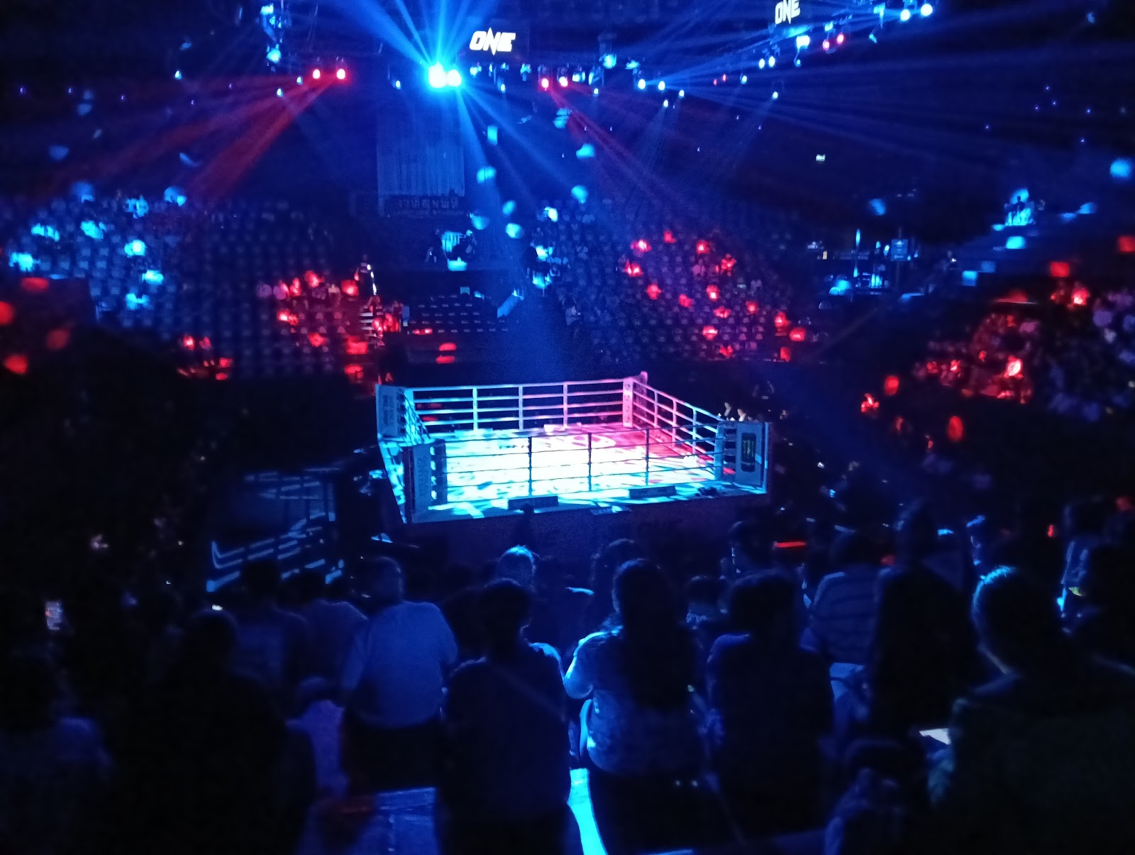 The lit ring inside Lumpinee Boxing Stadium during an evening event