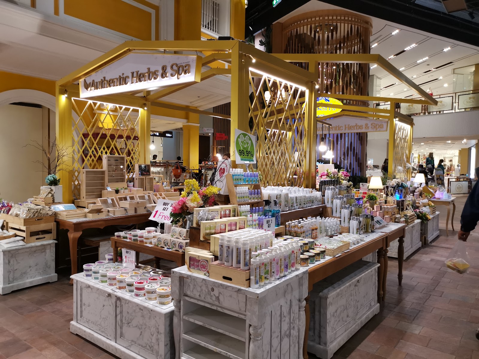 A herbs and spa stall with shelves of boxed Thai beauty products inside SOOKSIAM at ICONSIAM