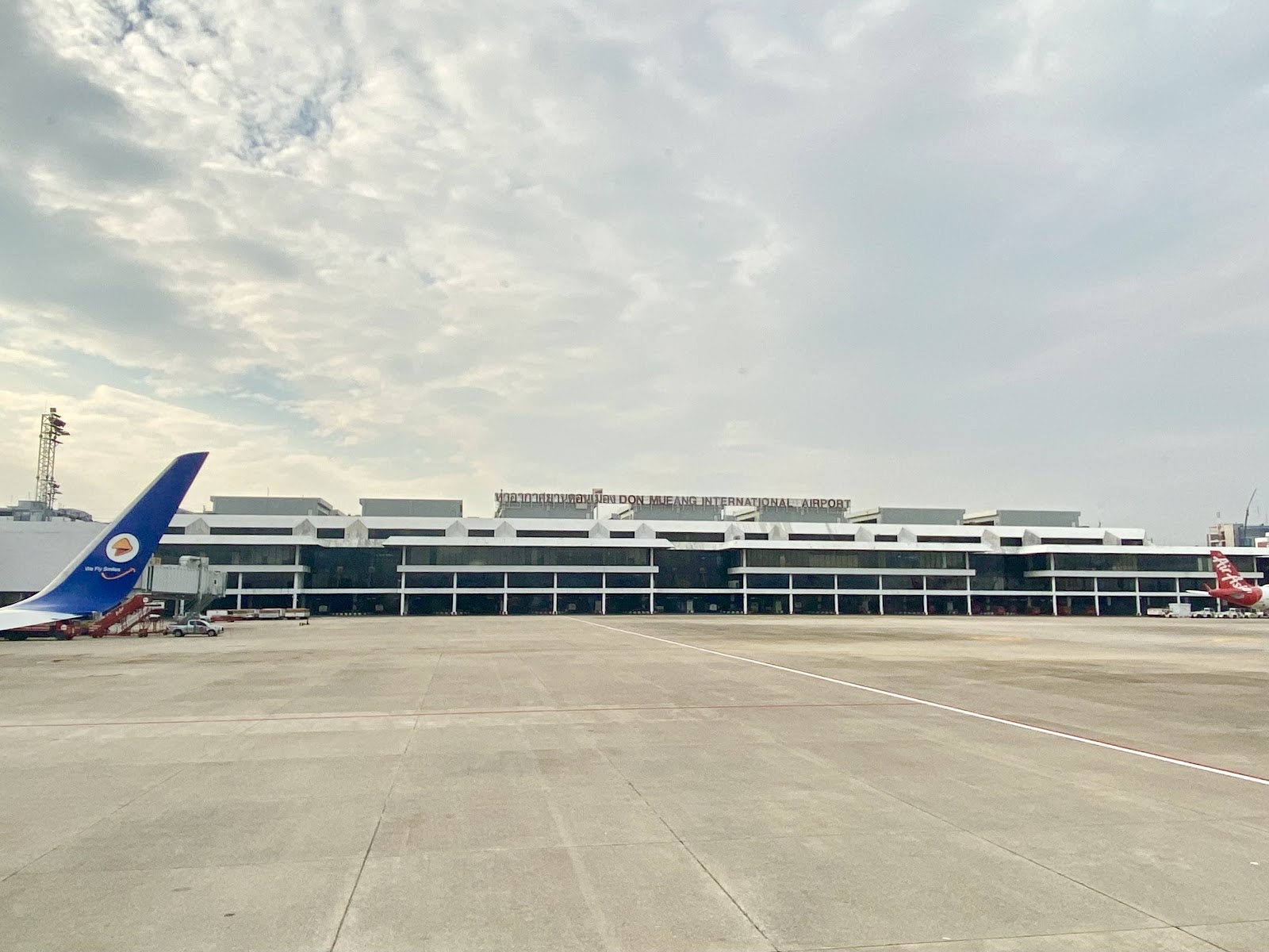 The terminal building of Don Mueang International Airport seen across the apron