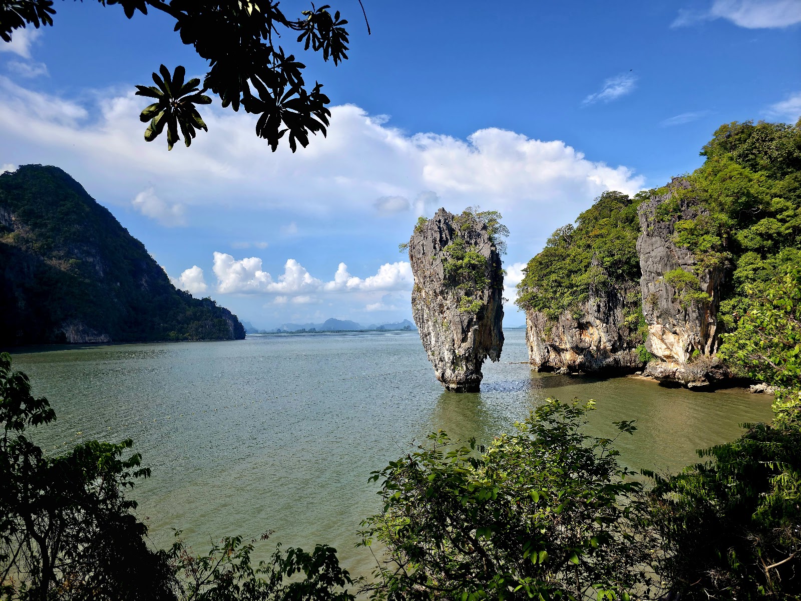 The narrow limestone pillar of Ko Tapu rising from the water beside Khao Phing Kan in Phang Nga Bay