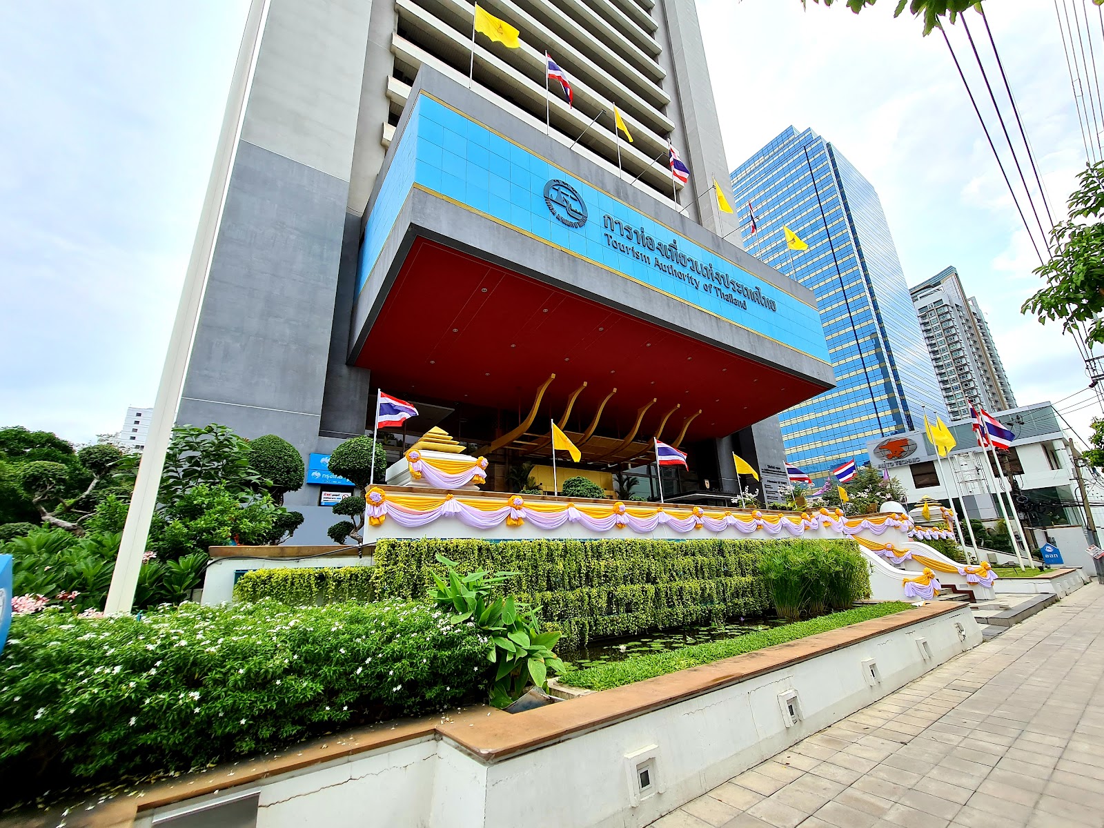 The Tourism Authority of Thailand head office building with its red entrance canopy