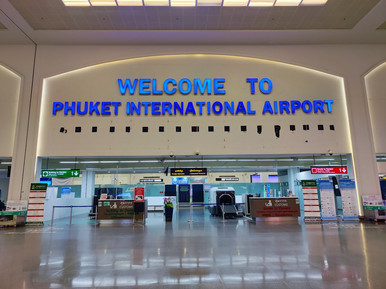 The Welcome to Phuket International Airport sign above the arrivals hall