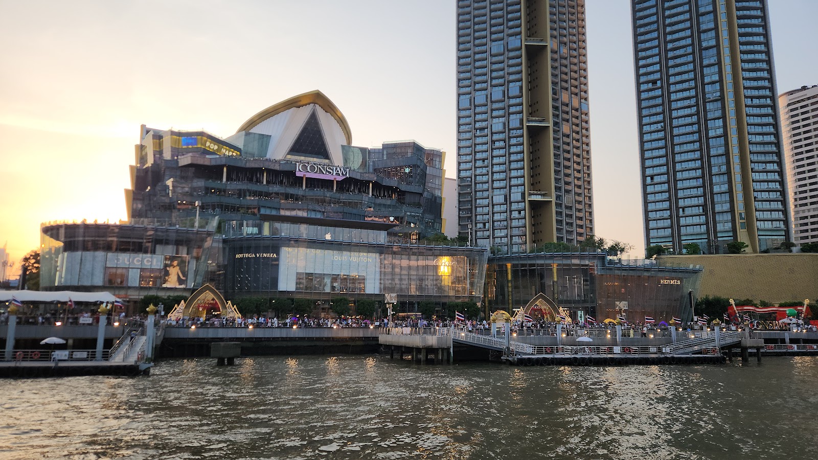 ICONSIAM and its riverside towers seen from the Chao Phraya at dusk