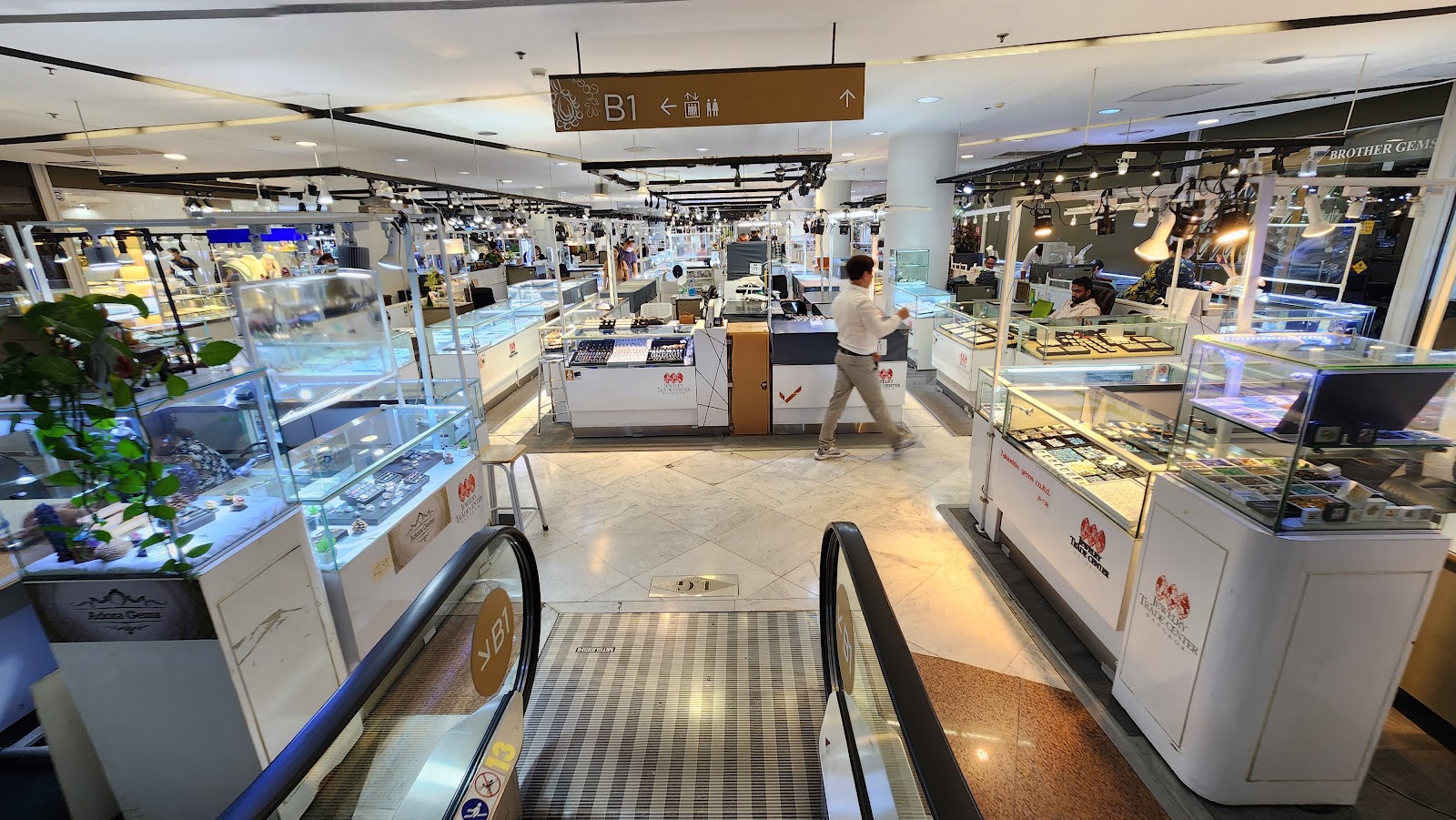 Rows of glass jewelry counters on a shopping floor of the Jewelry Trade Center on Silom Road
