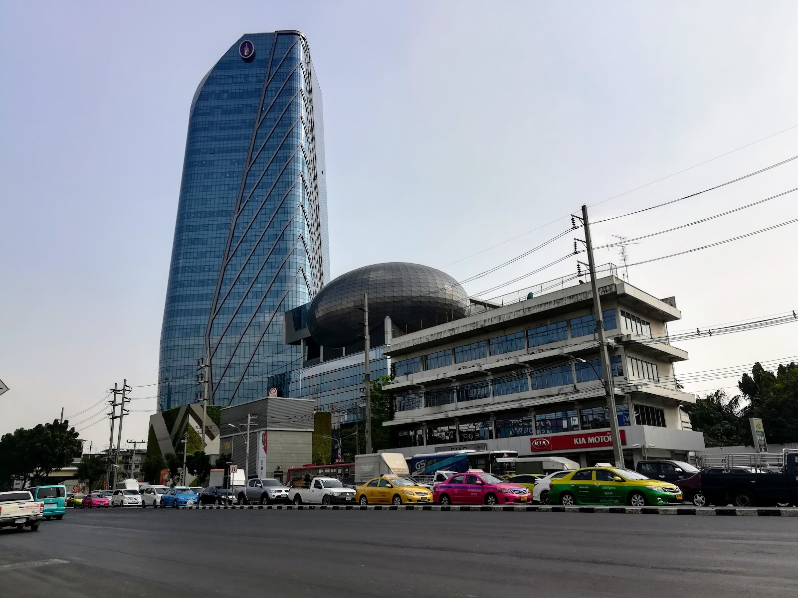 The glass tower and domed building of the Metropolitan Electricity Authority head office seen from Rama IV Road