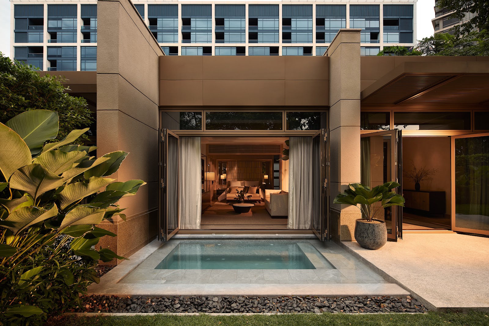 A Capella Bangkok villa terrace with a private plunge pool opening onto a living room