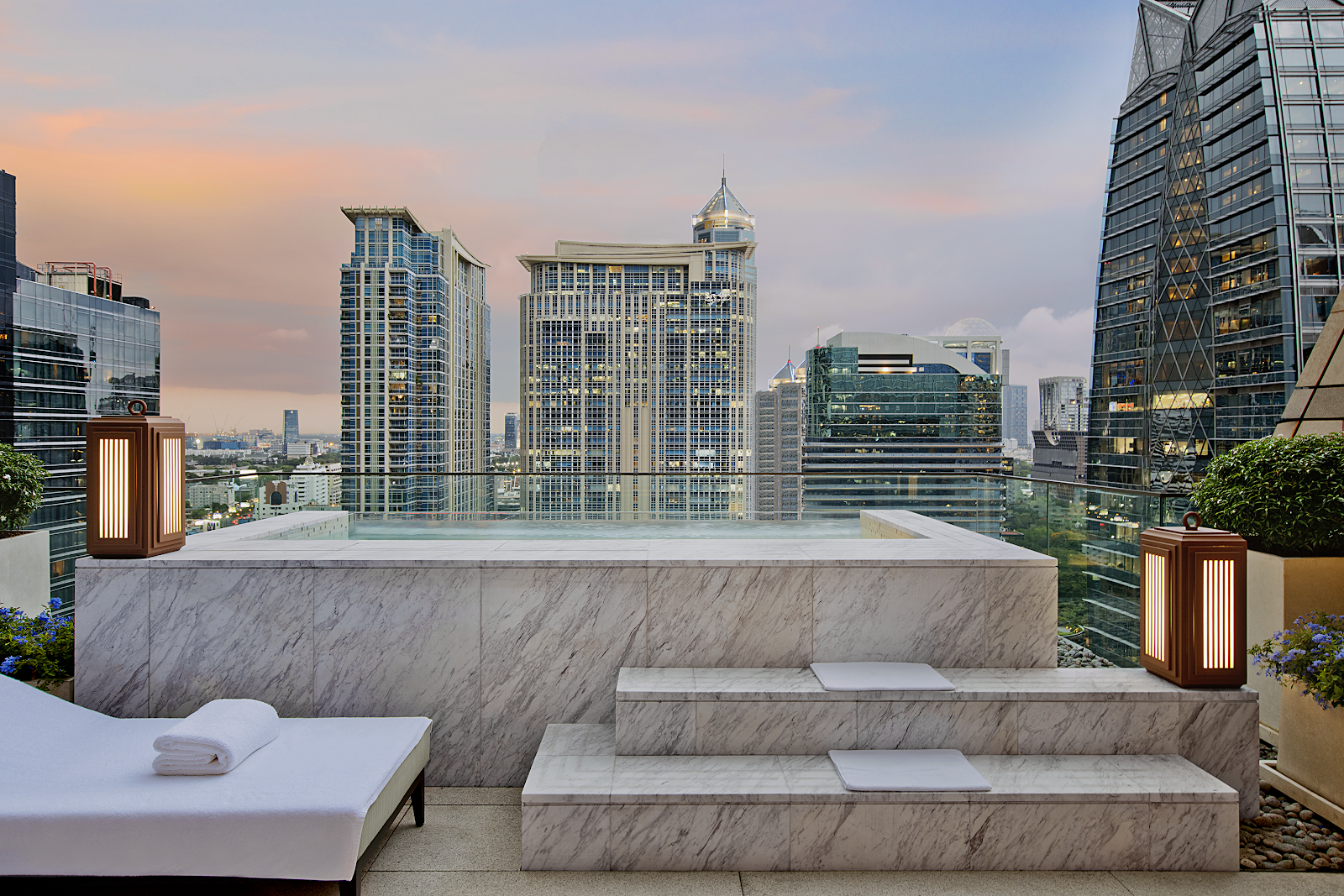 Terrace plunge pool of a Rosewood Bangkok house looking over the Phloen Chit skyline