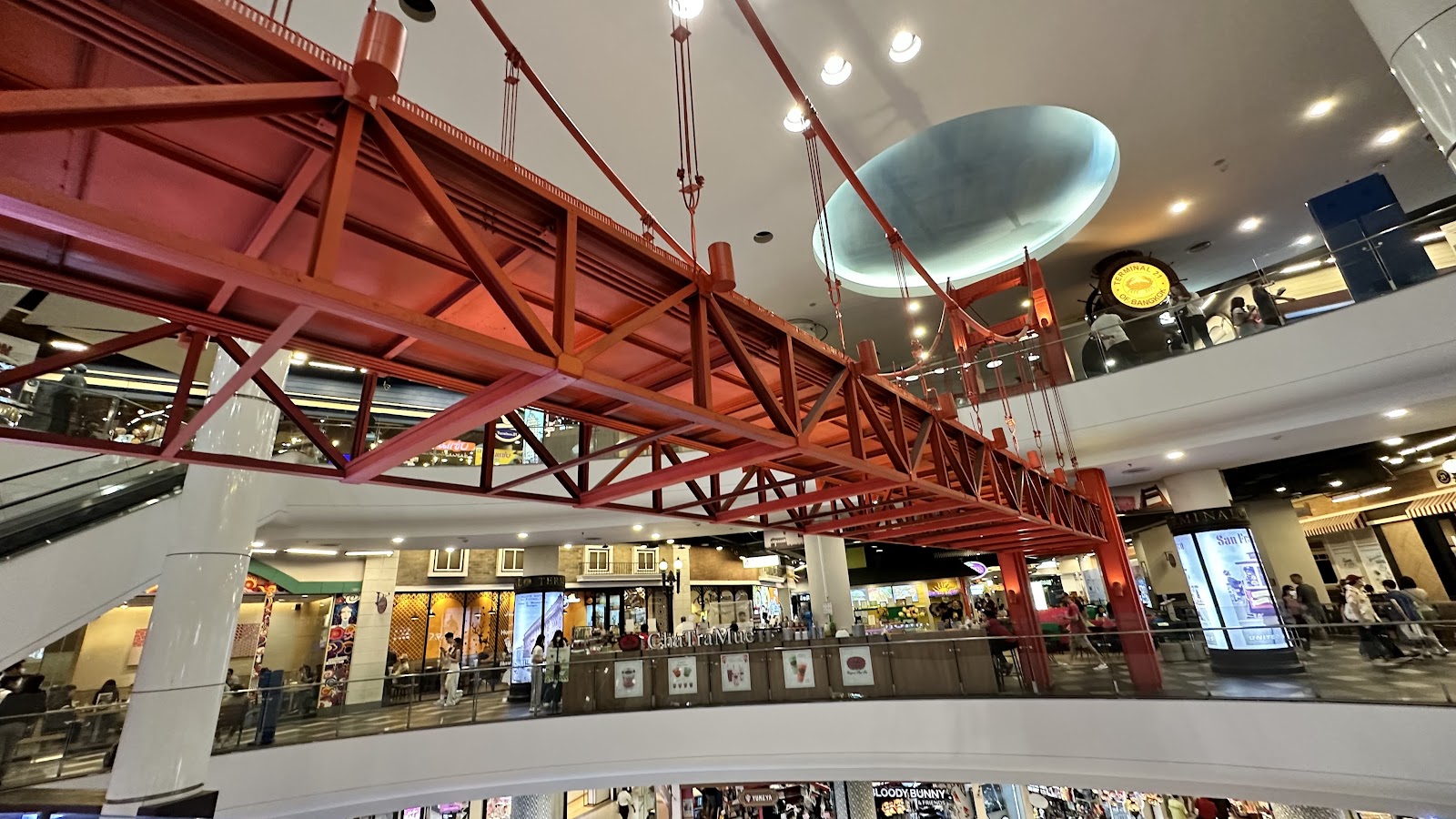 A red model of the Golden Gate Bridge above the San Francisco floor of Terminal 21