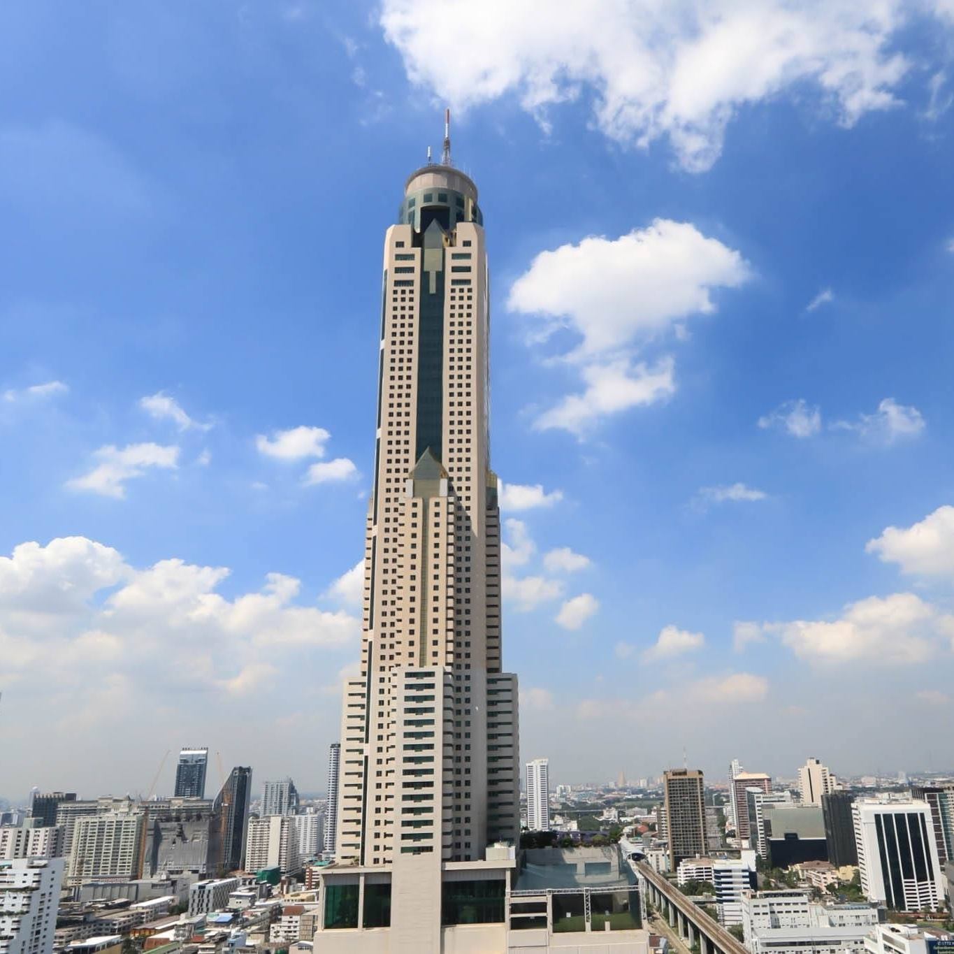 Baiyoke Sky Hotel tower against a blue sky in Pratunam, Bangkok