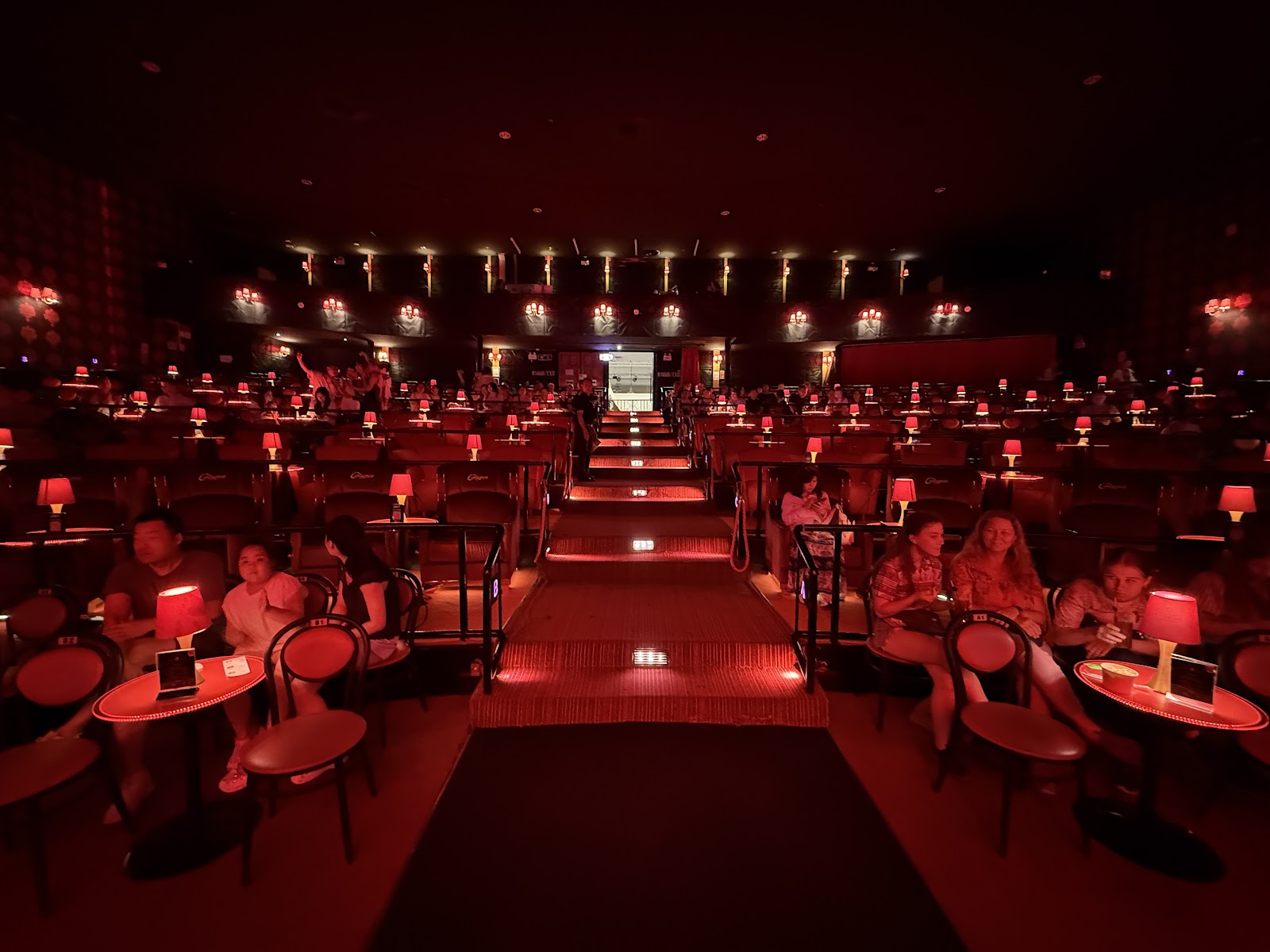 The red-lit auditorium of Calypso Cabaret in Bangkok before a show