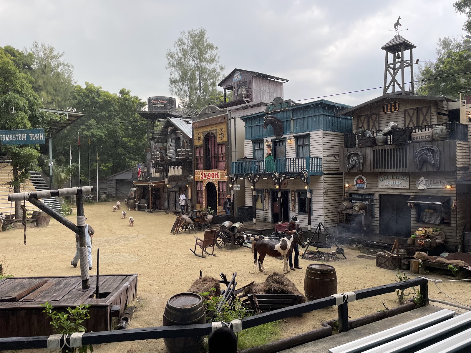 A western-town set with wooden storefronts and a water tower at Safari World