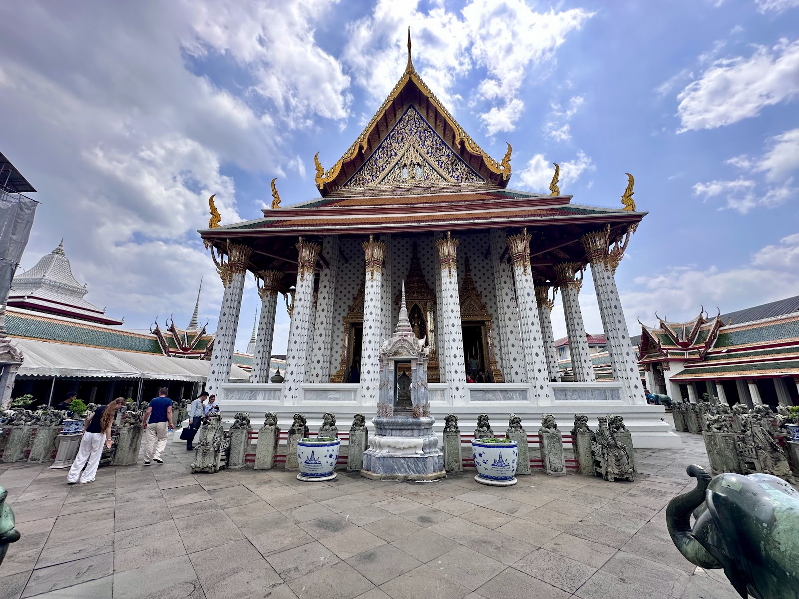 A white-columned pavilion with a tiered roof in the Wat Arun grounds