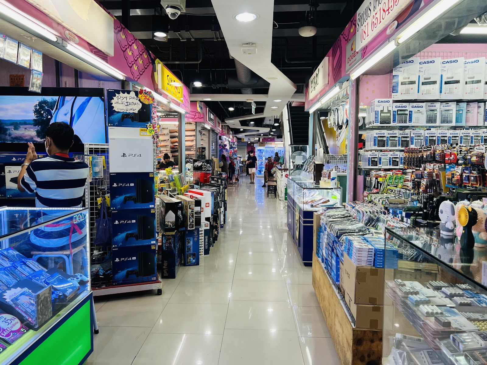 A corridor of toy and hobby shops inside Mega Plaza Saphan Lek