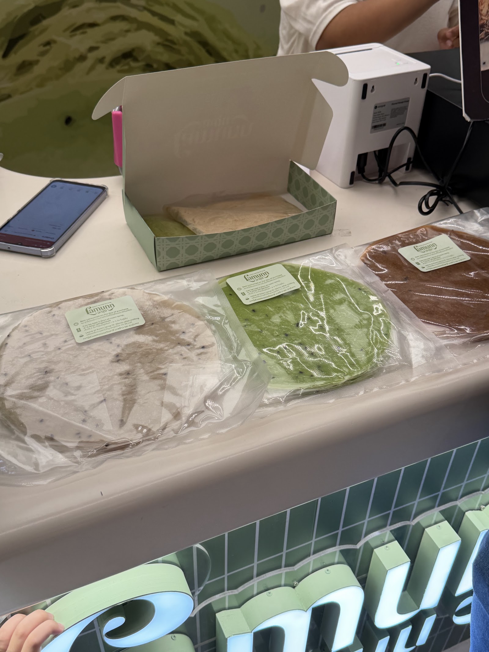 Packs of pastel roti sheets on the Lamunn counter at Central Embassy