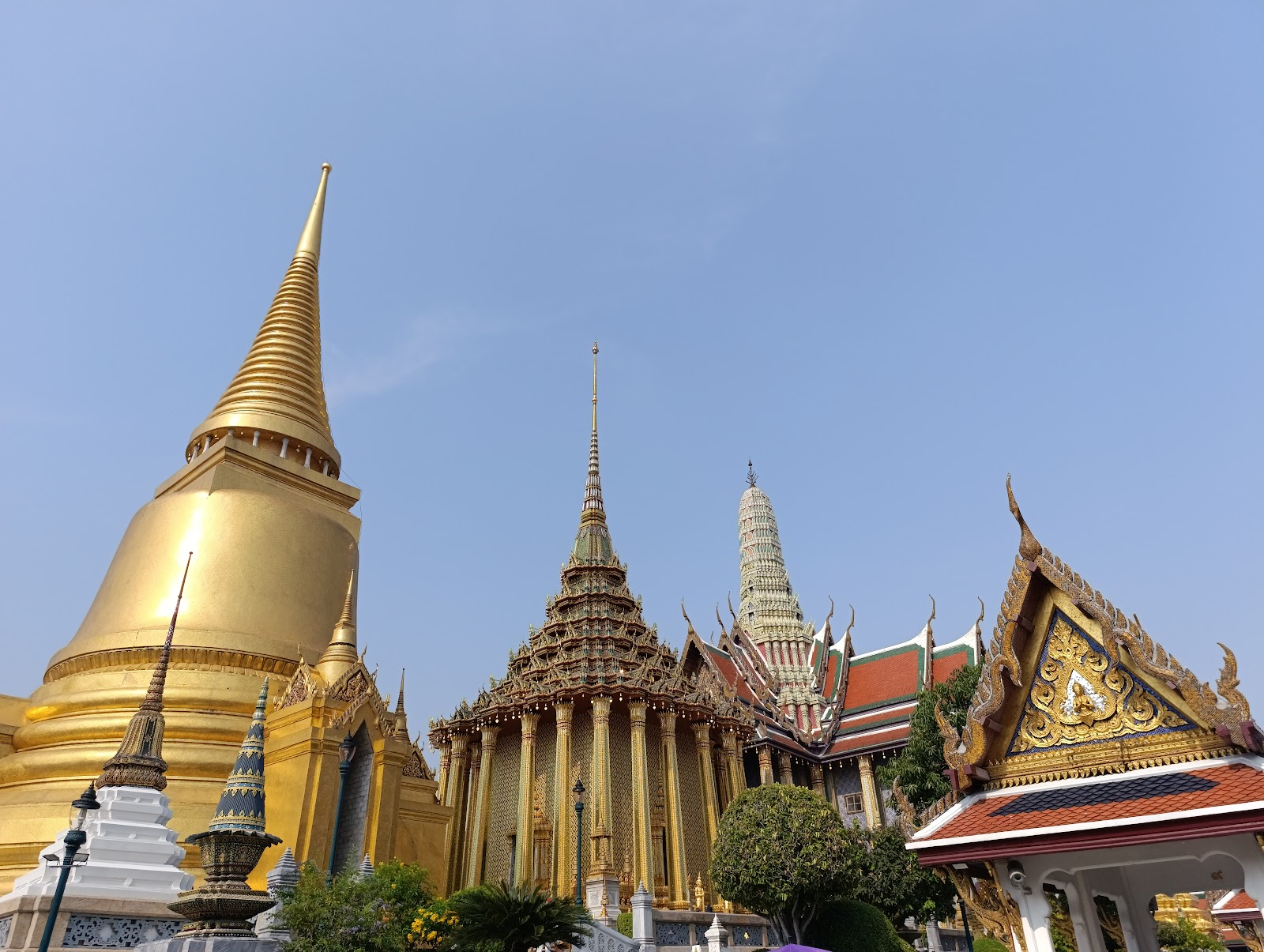 The golden chedi, the Phra Mondop and gilded roofs of the Temple of the Emerald Buddha inside the Grand Palace