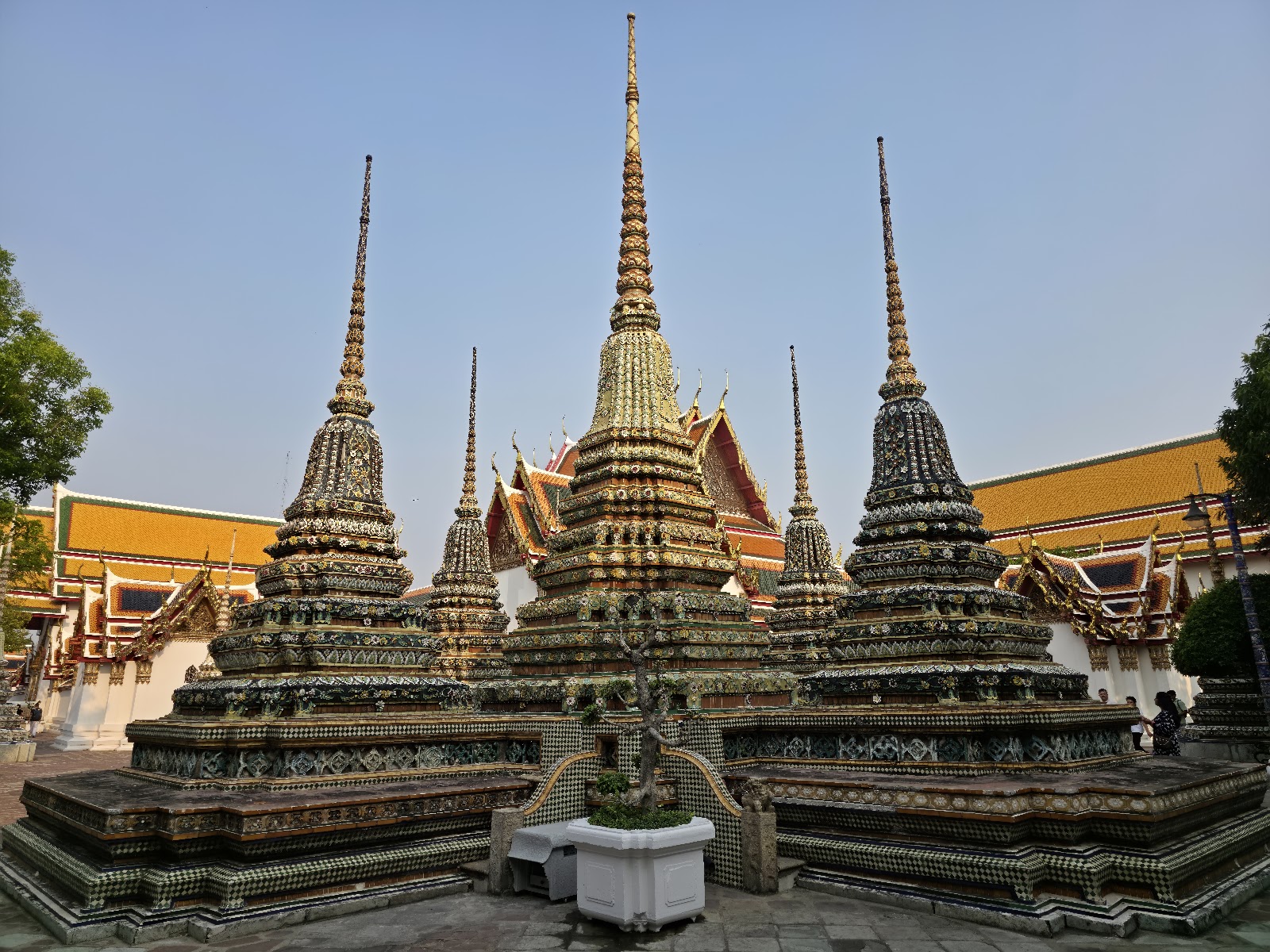 Tiled chedis rising above the courtyard at Wat Pho